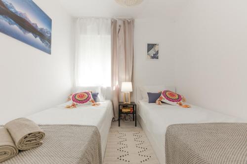 Postel nebo postele na pokoji v ubytování Apartment Lara