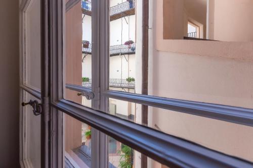 an open window with a view of a balcony at Barbo Palace Apartments and Rooms in Ljubljana