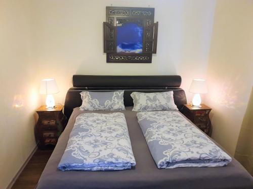 מיטה או מיטות בחדר ב-Ferienwohnung Royal Walchensee