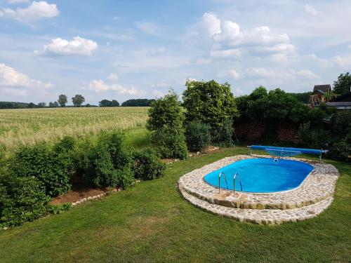 an overhead view of a swimming pool in a field at Landhaus-Lässig in Soltau