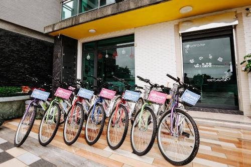 a row of bikes parked in front of a store at Lisinty Resort in Hengchun