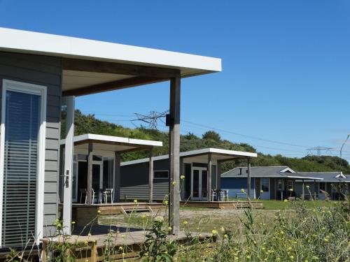 a row of modular homes in a row at Beach Lodges Oostvoorne in Oostvoorne