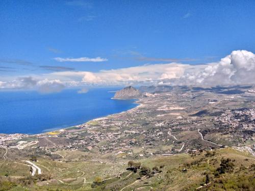 an aerial view of the ocean and a mountain at Hotel Edelweiss in Erice