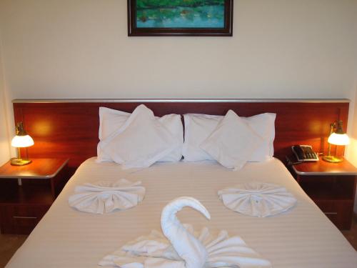 Postel nebo postele na pokoji v ubytování Hotel Ami