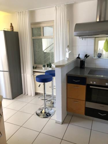 a kitchen with a sink and a stove top oven at Ferienimspessart OG in Bad Soden-Salmünster