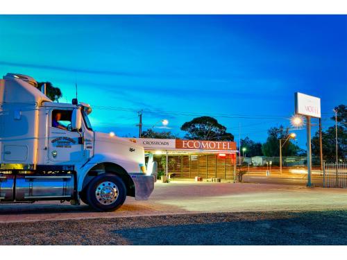 
a large truck parked on the side of a road at Crossroads Ecomotel in Port Augusta
