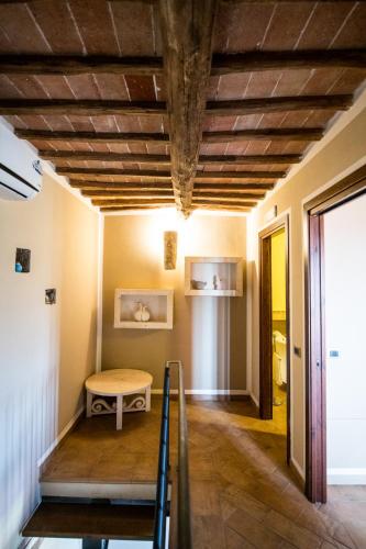 a room with a wooden ceiling and a table at Borgo San Faustino Country Relais and Spa Orvieto in Orvieto