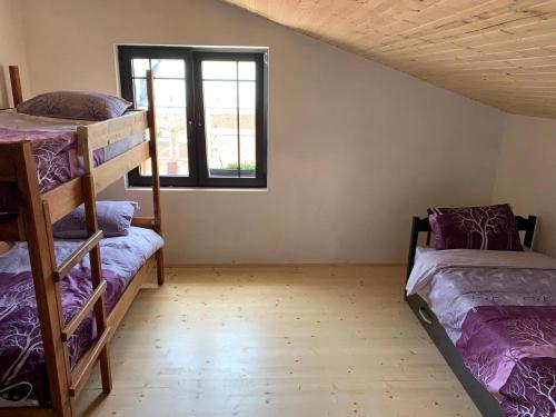 a room with two bunk beds and a window at Guest house Tivko Katce Gostivar in Gostivar
