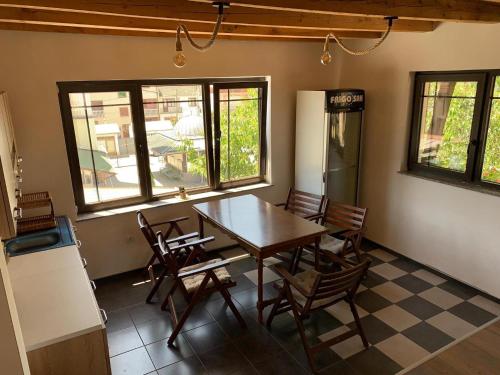 a dining room with a table and chairs at Guest house Tivko Katce Gostivar in Gostivar