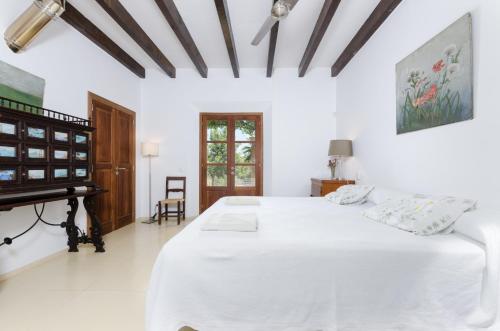 Postel nebo postele na pokoji v ubytování Puig De Garrafa