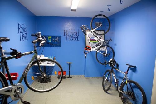 two bikes in a room with a blue wall at Hotel Royal in Fermo