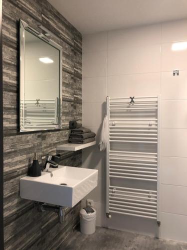 a bathroom with a sink and a mirror at Ubytování V Zátiší Lednice in Lednice