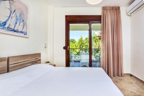 Postel nebo postele na pokoji v ubytování Sunset Villas