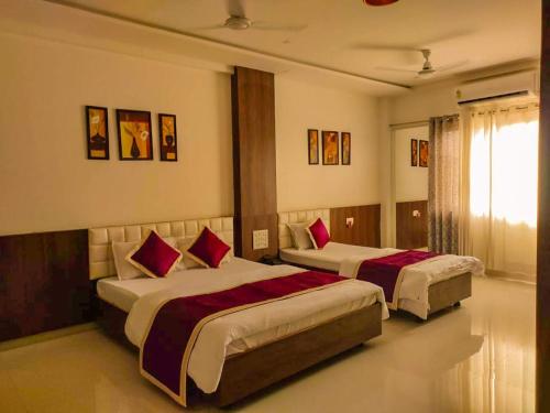Ein Bett oder Betten in einem Zimmer der Unterkunft Hotel Neem Tree