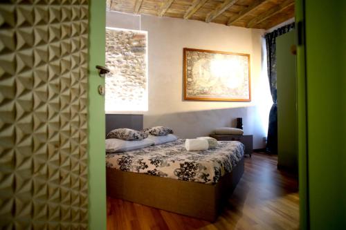 Postel nebo postele na pokoji v ubytování Epicuro guest house