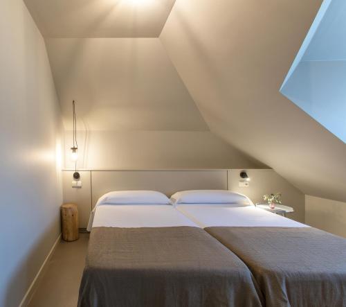 Postel nebo postele na pokoji v ubytování Apartamentos Dena