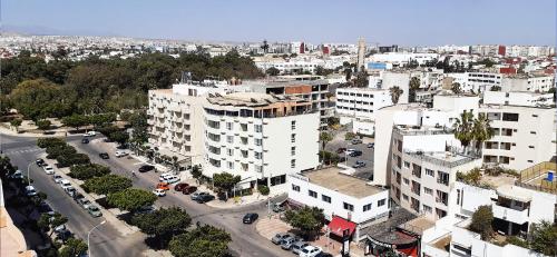 an aerial view of a city with buildings at New Farah Hotel in Agadir