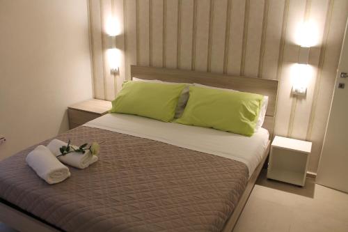 En eller flere senge i et værelse på Soffio del mare