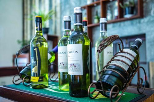three bottles of wine sitting on a table at Insight Resort Ahangama - S&S Other Certified in Ahangama