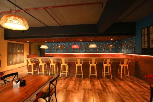 a bar with a row of bar stools at Sayaji Rajkot in Rajkot