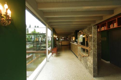 a hallway of a restaurant with a large window at La Boheme Chambres in Lazise