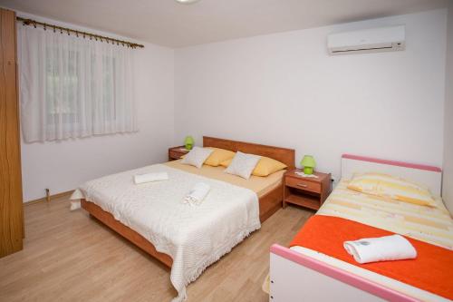 Un ou plusieurs lits dans un hébergement de l'établissement Apartments Petar - free parking