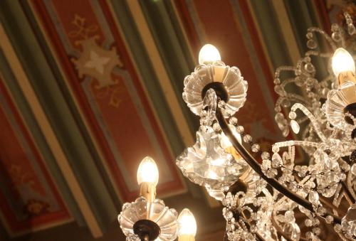 a close up of a chandelier in a room at Chateau LE BROSSAY in Renac
