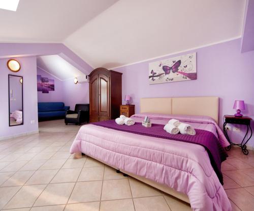 Łóżko lub łóżka w pokoju w obiekcie Sosta dei Garibaldini