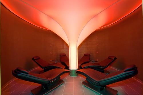 a group of chairs in a waiting room with a light at Vitalhotel der Parktherme in Bad Radkersburg