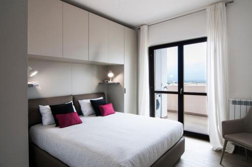 Giường trong phòng chung tại Fonte Laurentina Apartments