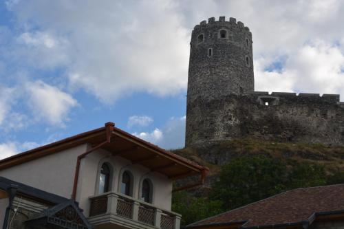 a building with a tower on top of a castle at Golden Gate in Akhaltsikhe