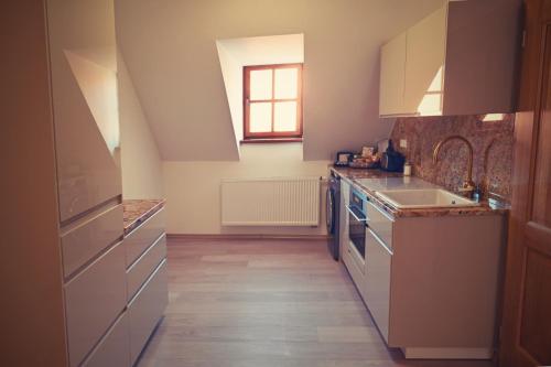 a kitchen with a sink and a counter top at Bed&Bike Prachatice in Prachatice