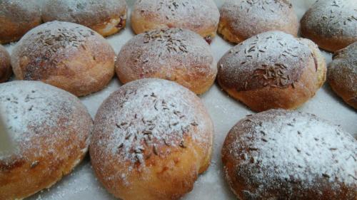a bunch of donuts with powdered sugar on them at Rezydencja Izabella in Wisła