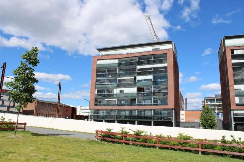an office building with a crane on top of it at Menuetti - best lake view in Jyväskylä
