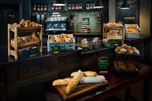 a bakery with bread and pastries on a counter at Kilmurry Lodge Hotel in Limerick