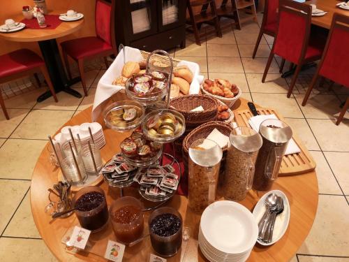 a table with a bunch of food on it at Tuniberg Restaurant Hotel in Freiburg im Breisgau