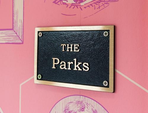 a sign that reads the parks on a pink wall at The Germantown Inn in Nashville