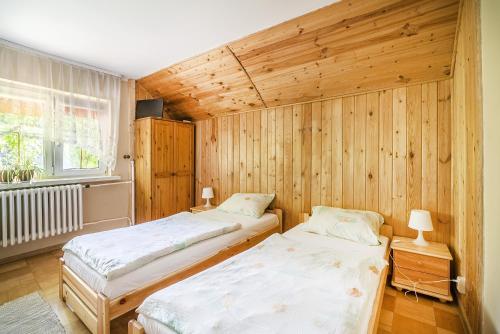 Posteľ alebo postele v izbe v ubytovaní Agroturystyka Carski Trakt