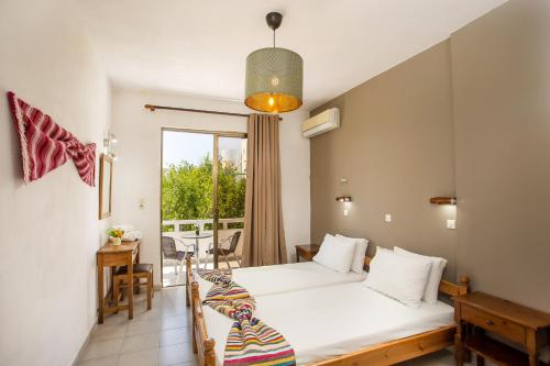 מיטה או מיטות בחדר ב-Marieta-Giannis