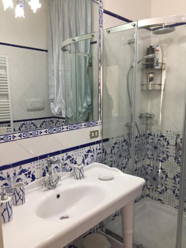 a bathroom with a sink and a shower at Villa Flora in Vico Equense