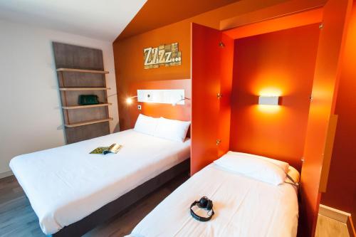 Кровать или кровати в номере Ibis Budget Château-Thierry