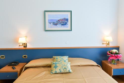 Postel nebo postele na pokoji v ubytování Hotel Souvenir