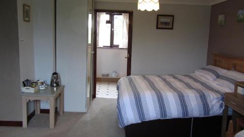 Heathergate Cottage Dartmoor BnBにあるベッド