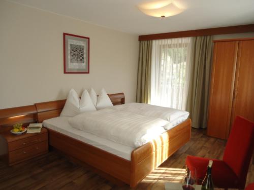 En eller flere senger på et rom på Hotel Klammwirt