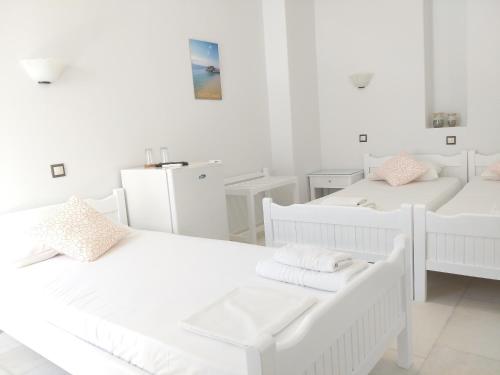Postel nebo postele na pokoji v ubytování Syrianos Hotel