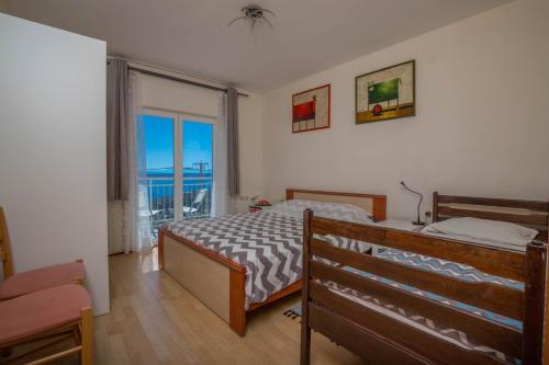 Postel nebo postele na pokoji v ubytování Apartman Zlatica