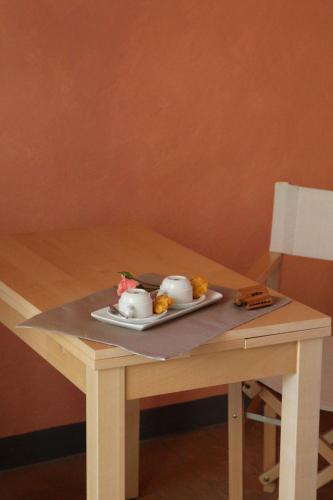 a plate of food on a wooden table at A Casa Di Mìnola in Roe