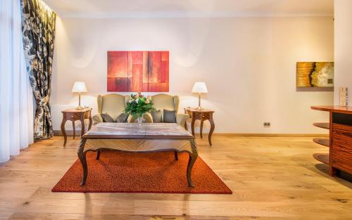 a living room with a table and chairs at Residence Bellevue in Boppard