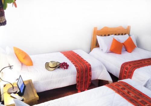 Postel nebo postele na pokoji v ubytování Hotel Viñas del Sol Eterno