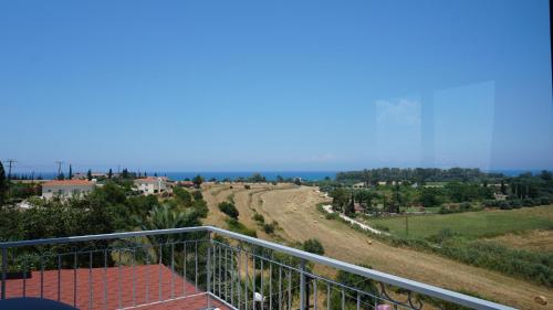 a view of the ocean from the balcony of a house at Panoramic sea view apartment in Polis-Latchi in Polis Chrysochous